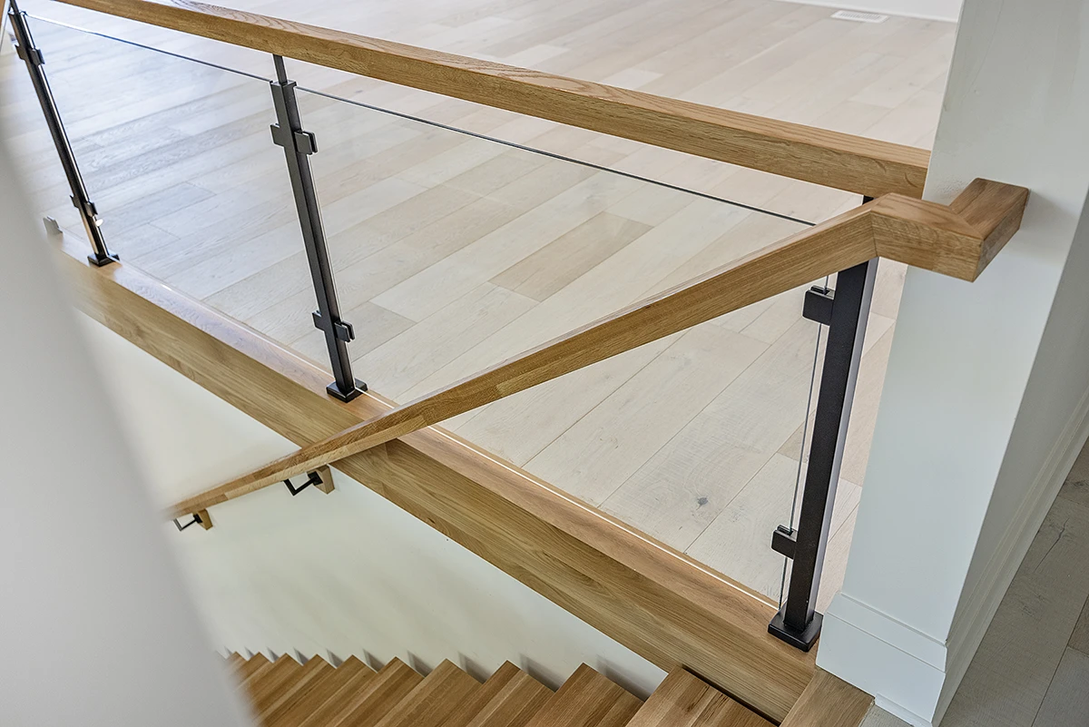 Frameless glass railing secured with stainless steel hardware.