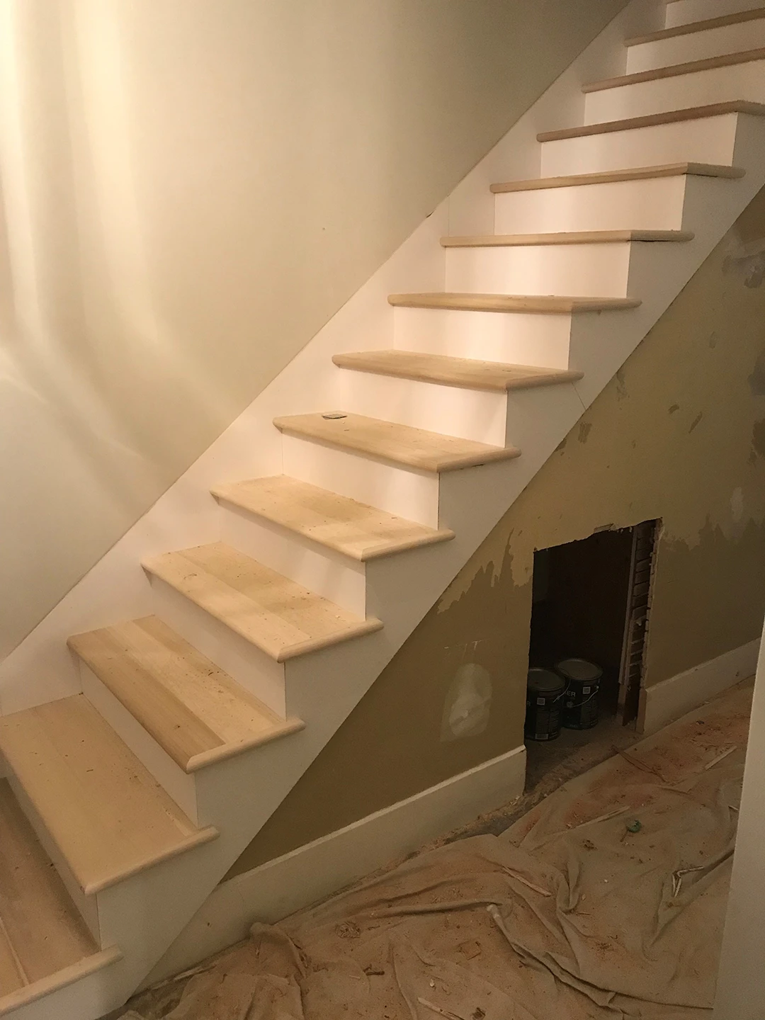 Newly installed wood stair treads before finishing.