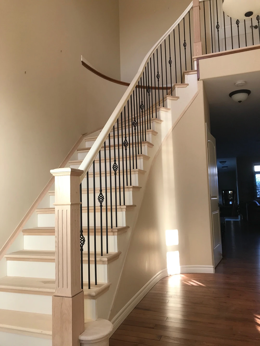 Staircase after refinishing with updated wood treads.