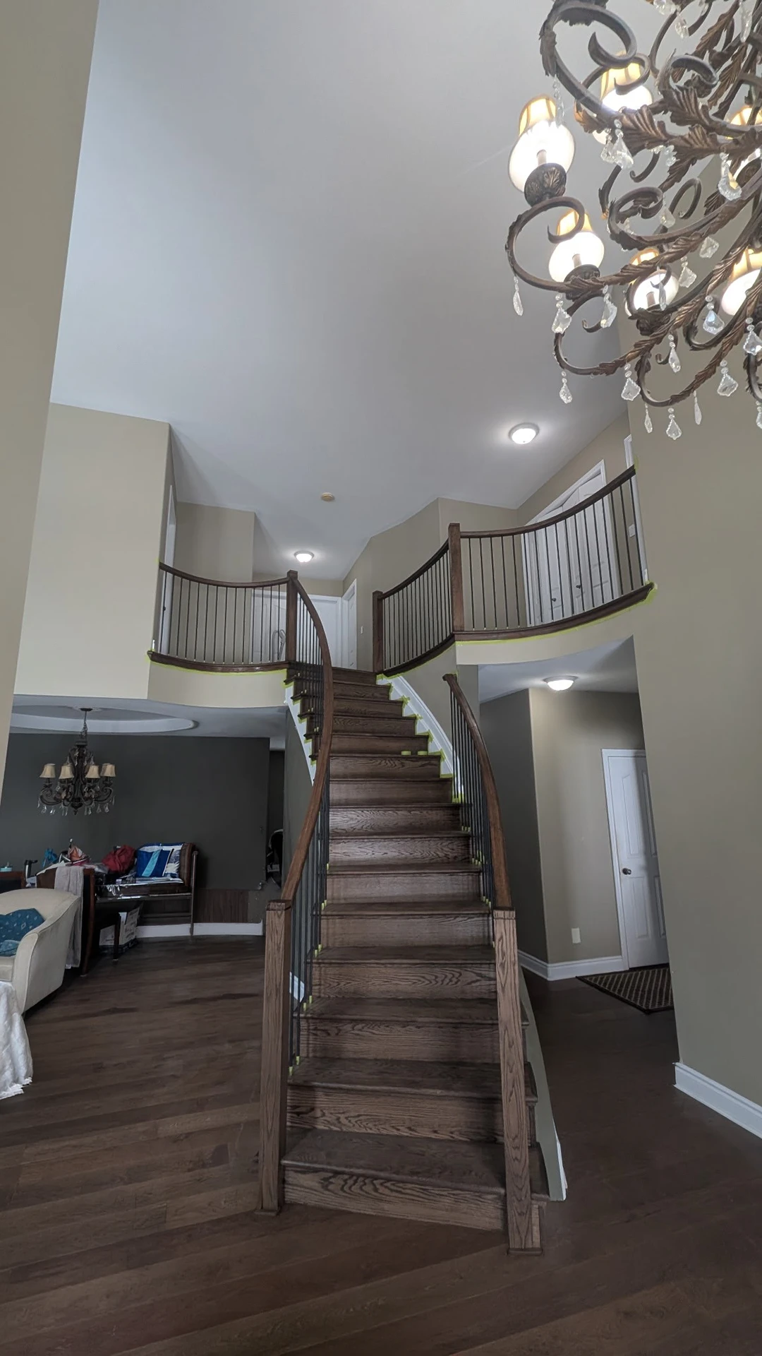 Curved staircase after refinishing and railing upgrade.