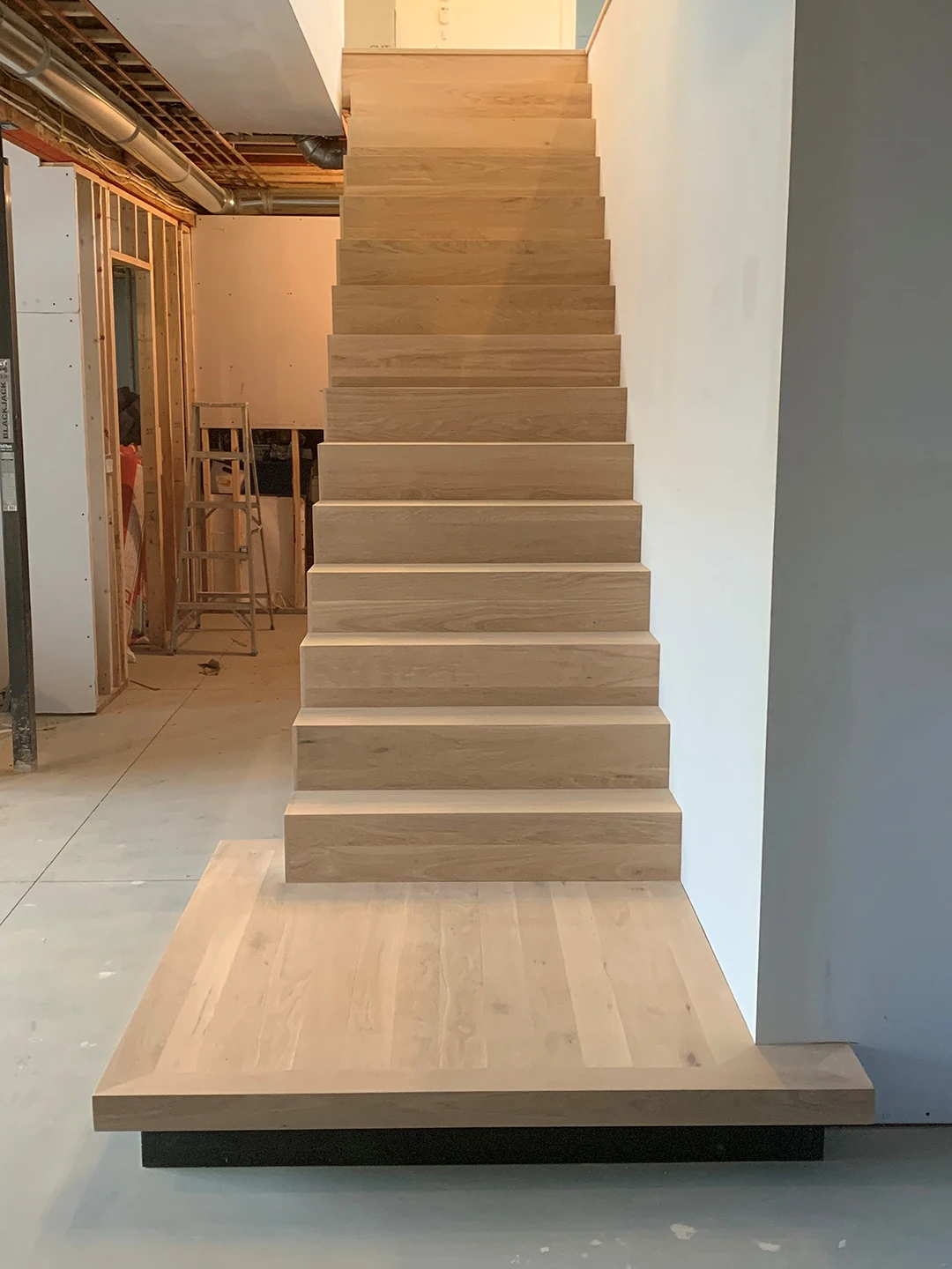 Finished staircase after hardwood stair renovation.