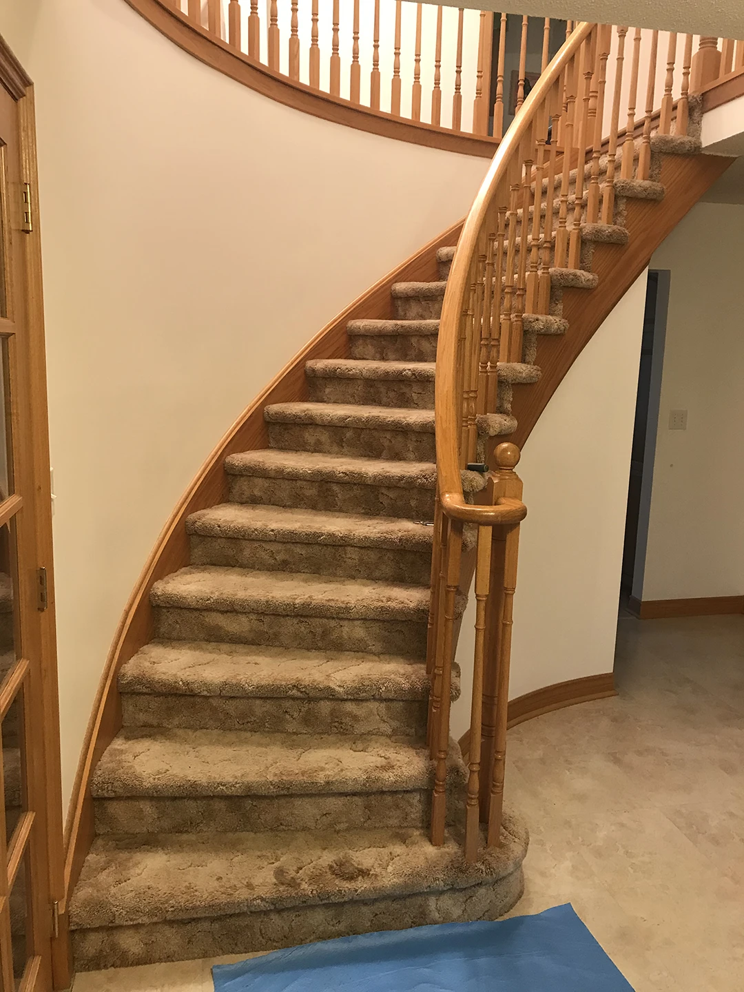 Original curved staircase before refinishing.