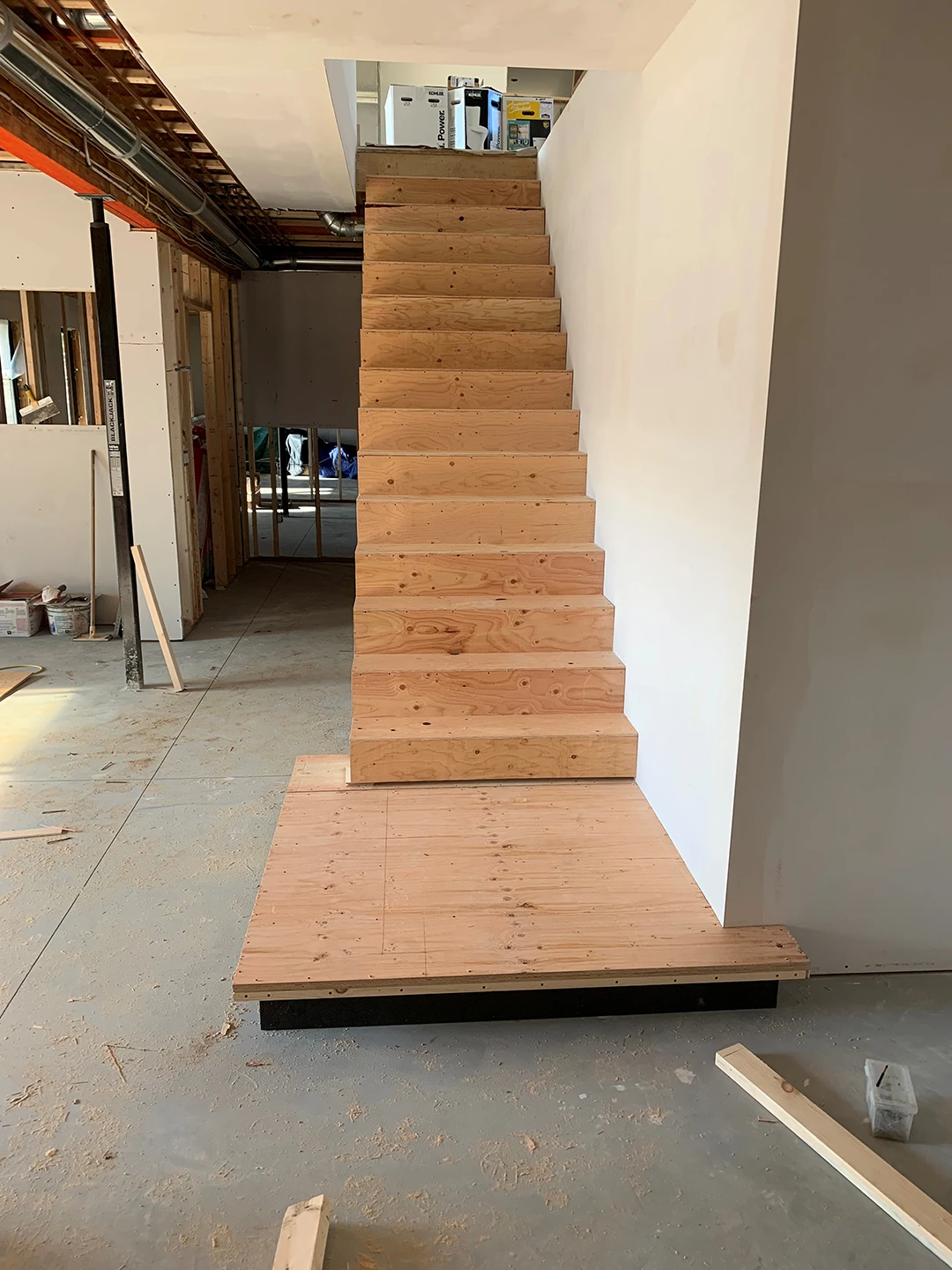Original unfinished staircase before renovation.