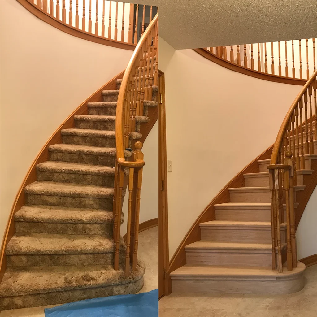 Curved staircase with refinished wood railings.