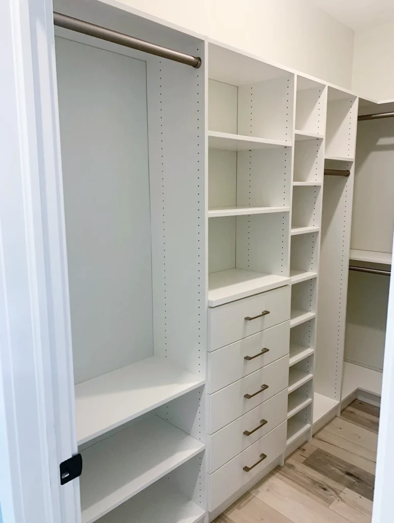 Custom walk-in closet with built-in shelving.