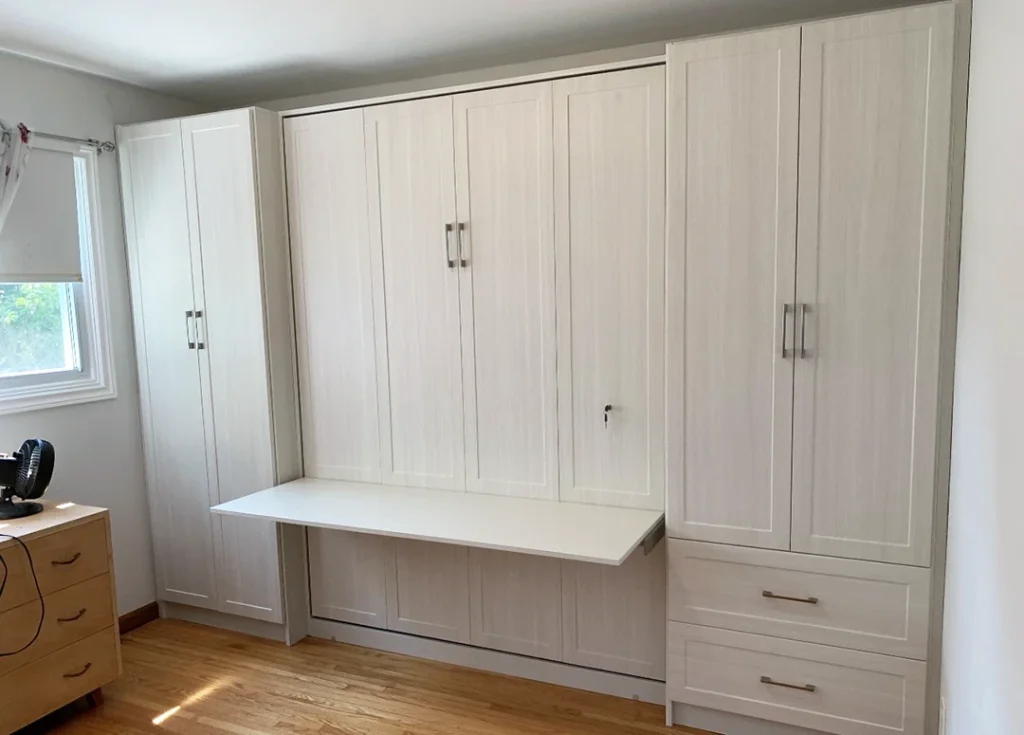 White built-in wardrobe with shaker-style cabinet doors.