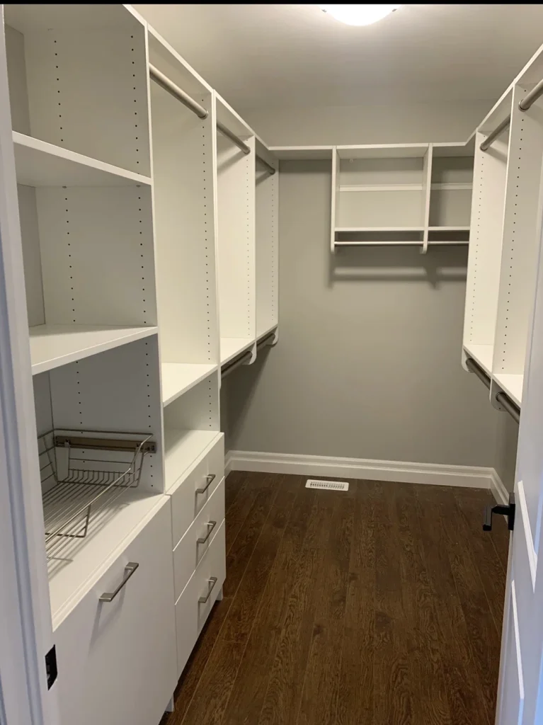 Spacious walk-in closet with custom storage solutions.