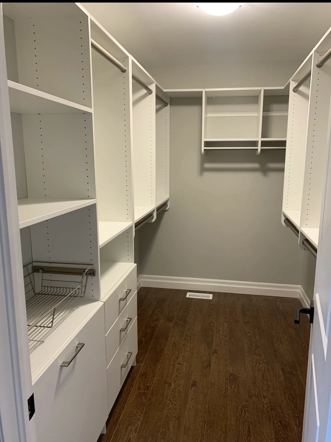 Spacious walk-in closet with custom storage solutions.