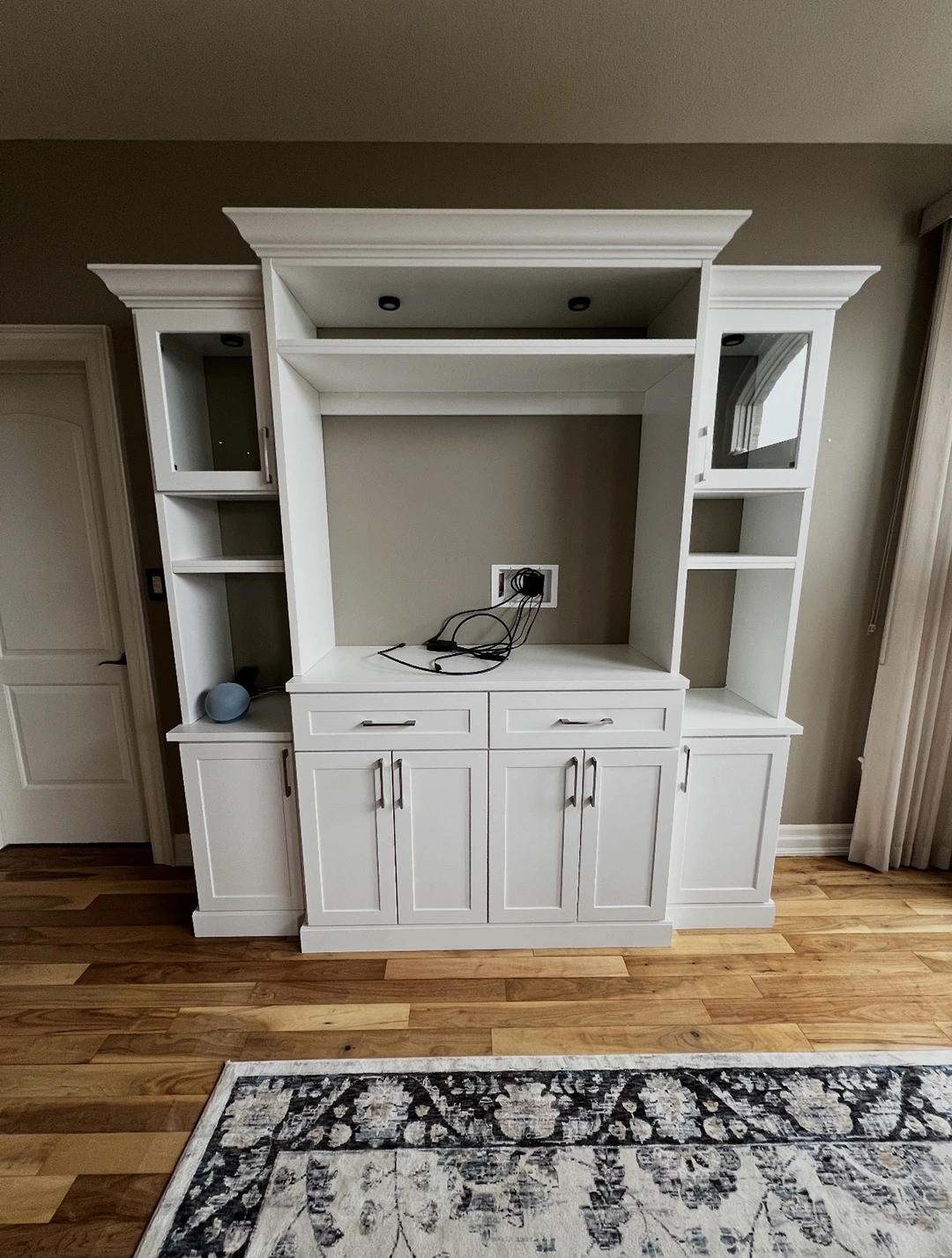 Custom built-in cabinetry with integrated desk and storage.